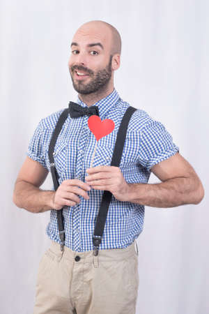 Bald man holding a heartの写真素材