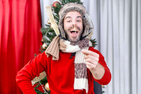 Happy man for Christmas holding a sparkle
