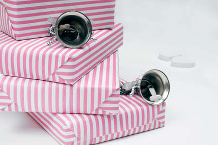Pastel pink gifts and silver bellsの写真素材