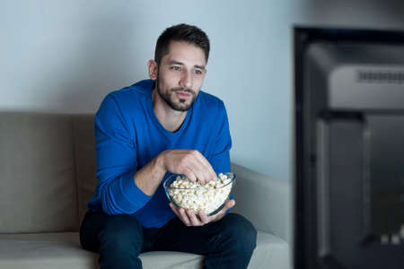 Man watching televisionの写真素材