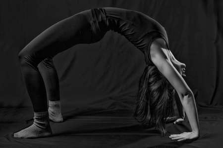 Woman stretching in black and white