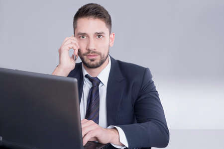 Businessman speaking on a cell phoneの写真素材