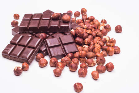 Chocolate bars and hazelnutsの写真素材