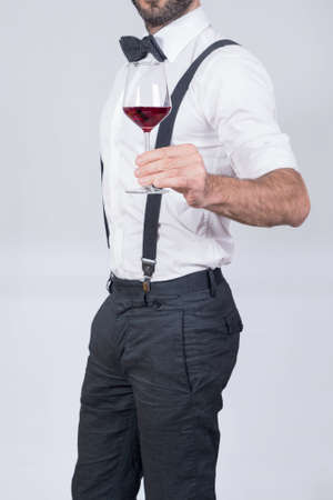 Man making a toast with a wine glassの写真素材