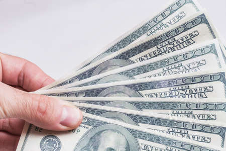 Dollar bills in a handの写真素材