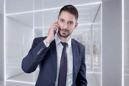 Businessman using a cell phoneの写真素材