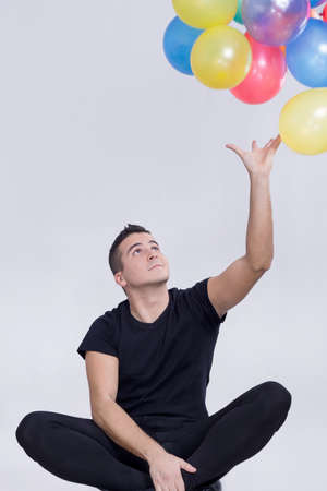 Boy playing with balloonsの写真素材