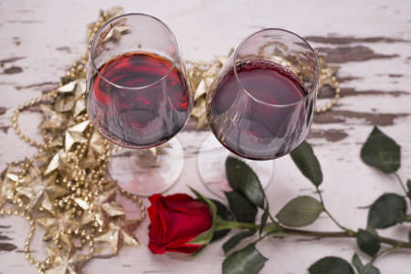 Two wine glasses and a roseの写真素材