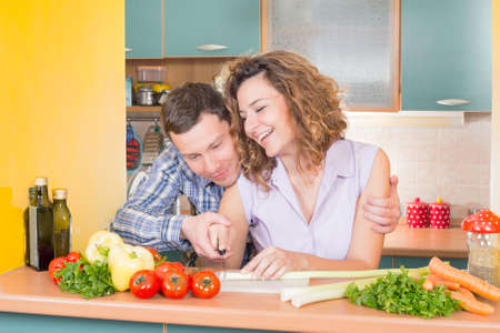 Happy couple in the kitchenの写真素材