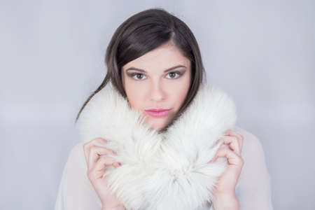 Beauty shot of a girl with a white furの写真素材