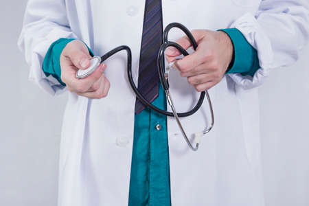 Stethoscope in doctors handsの写真素材