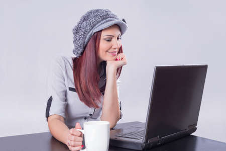 Redhead watching movies on laptopの写真素材