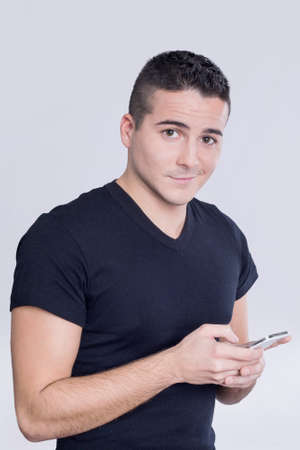 Man typing on his smartphoneの写真素材