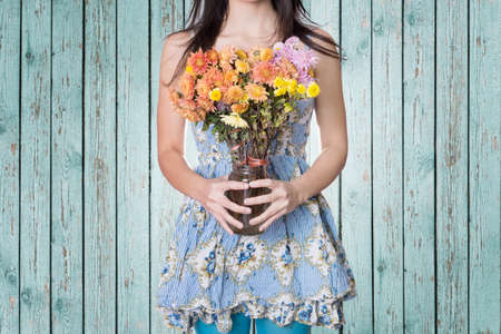 Hipster woman and flowersの写真素材