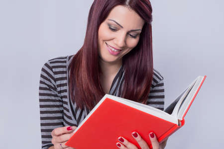 Woman reading a bookの写真素材