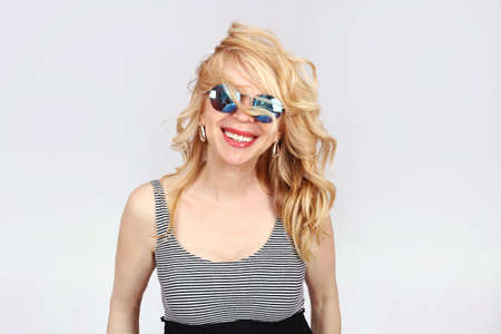 Happy blonde woman in studioの写真素材