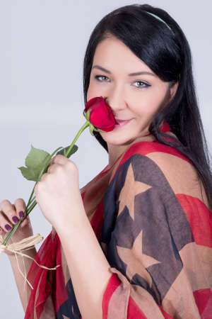 Patriotic girl smelling a roseの写真素材