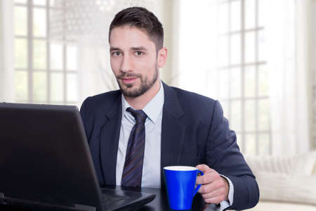 Businessman having a coffeeの写真素材