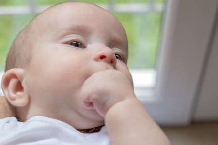 Baby boy sucking his finger