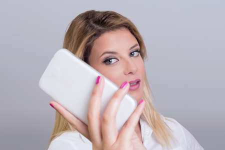 Blond girl taking a selfieの写真素材
