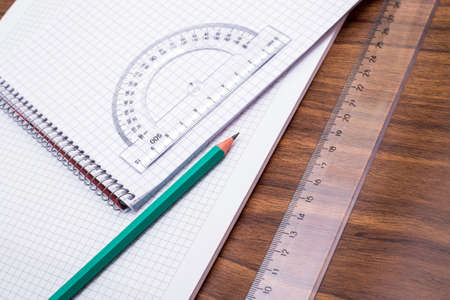 Ruler and notebook on a tableの写真素材