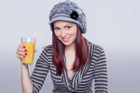 Redhead girl having a juiceの写真素材