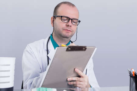 Doctor writing down