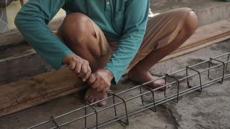 construction worker using steel rod at construction site, construction concept.の写真素材