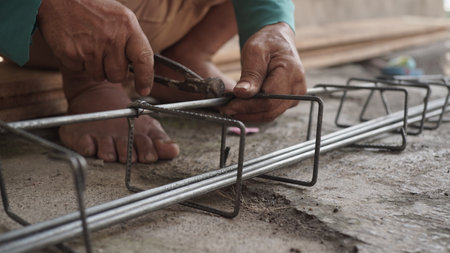 Workers are installing steel structure at construction site. The concept of building a house.の写真素材