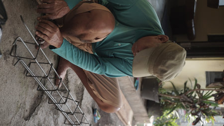 Climber climbing on the wall of a building in Sri Lankaの写真素材
