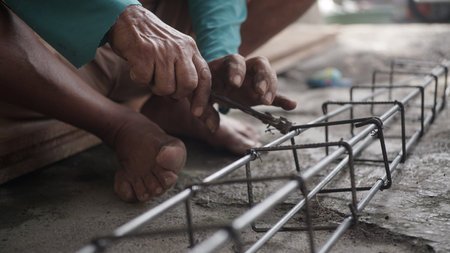 Close up of a man working on a construction site. Construction concept.の写真素材