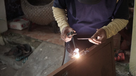 Welder working with a torch in his workshop. Selective focus.の写真素材