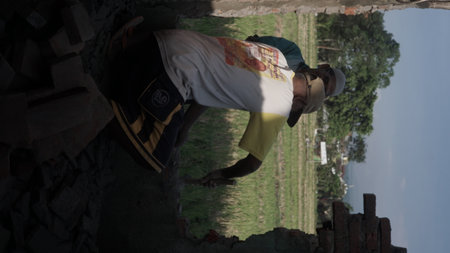 A man is trying to get out of the hole in the wallの写真素材