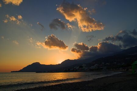 amazing sunset in plakias beach with beautiful landscapeの写真素材