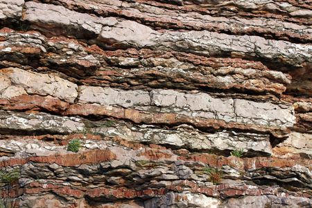 This is a closeup shot of some old cliff on the sea, like nice background.
