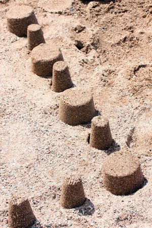 this is a some sand towers, on the sea beach.