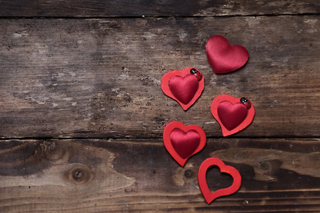Red hearts on the wooden boardsの写真素材