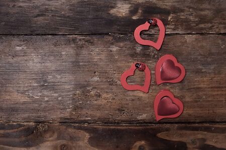 Red hearts on the wooden boardの写真素材