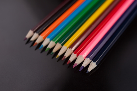 A colored pencils on a black tableの写真素材