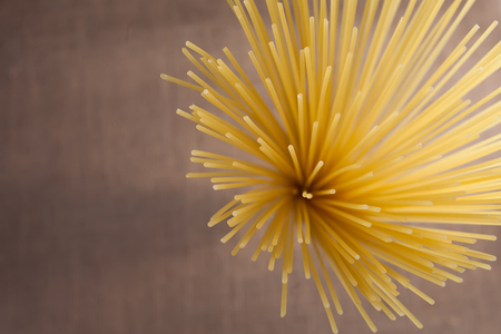 pasta macaroni from the up on a textureの写真素材