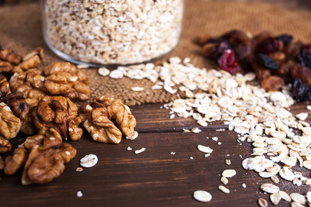 Different kinds of nuts and dry fruits on the wooden table