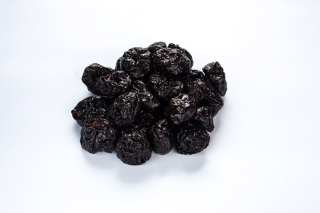 A heap of prune on white background isolatedの写真素材
