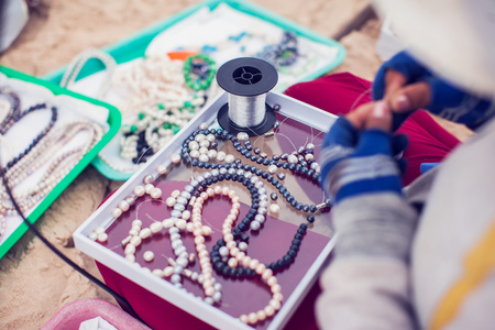 Woman creating Handmade jewelryの写真素材