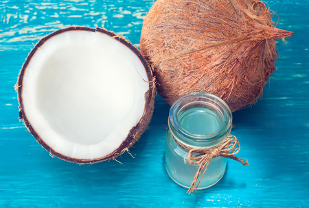 coconut and coconut milk on wooden tableの写真素材