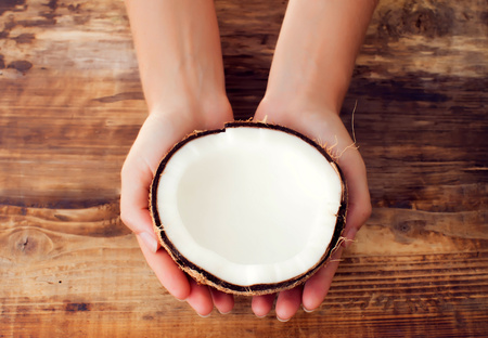 coconut and coconut milk on wooden tableの写真素材