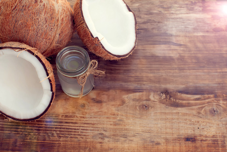 coconut and coconut milk on wooden tableの写真素材