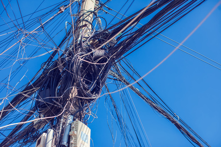 Messy electric wiring on the pole