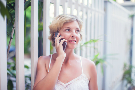 Young Beautiful Woman Talking On Mobile Phone Outdoor.の写真素材