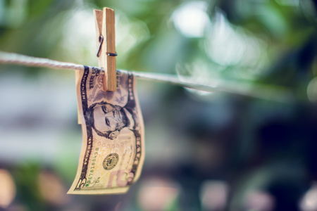 US dollar banknotes hanging on rope for money laundering coneptの写真素材