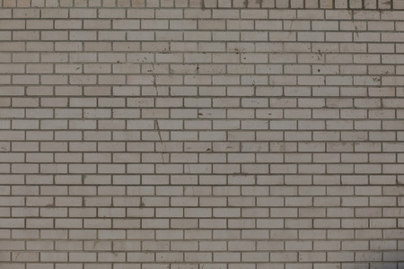 brick wall texture grunge background with vignetted corners, may use to interior designの写真素材